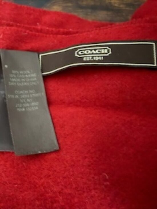 il_1080xN.3759282619_tpqc.jpg Timeless Coach wool scarf in a deep red shade with elegant fringe and the iconic